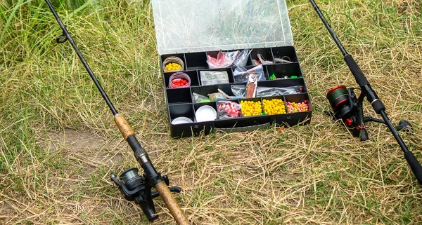 Fishing tackle on the river bank, bait rod, spinning rod, fish. Nature. Selective focus