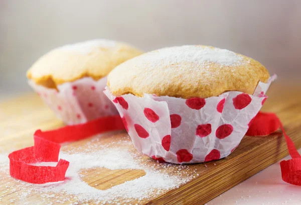 Tasty muffins covered with sugar — Stock Photo, Image