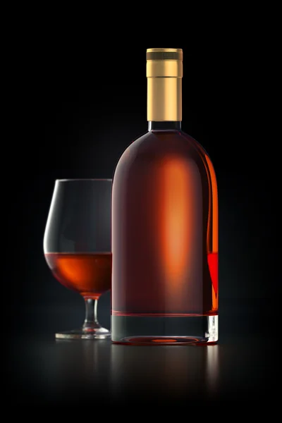 Brandy bottle mockup with glass — Stock Photo, Image