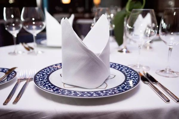 Table Setting With Napkin On Plate, Fork, Knife And Glasses