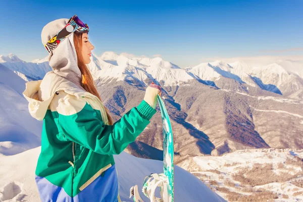 Snowboard. Sport woman in snowy mountains — Stock Photo, Image