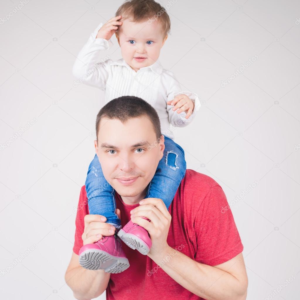 Happy father holding child at white background
