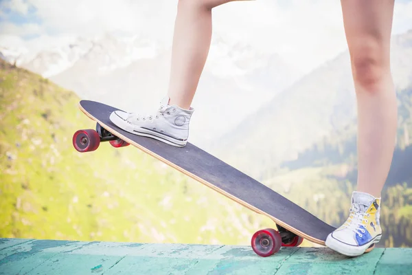 Hipster fashion girl, relaxing, holding skateboar — Stock Photo, Image