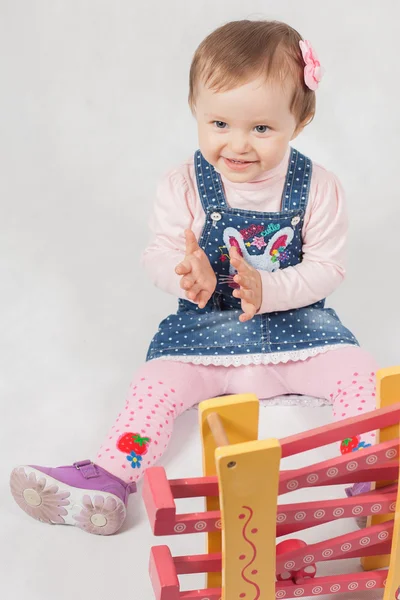 Surprised baby girl playing with toy game for development — Stock Photo, Image