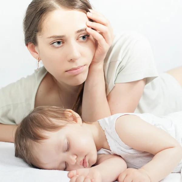 Sad mother with baby — Stock Photo, Image