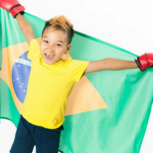 Brazilian patriot boy holding Brazil flag. Football or soccer championship — Stock Photo, Image