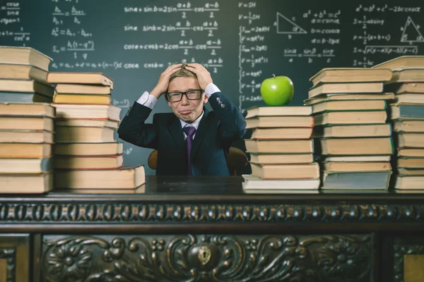 School boy in stress at school classroom — Stock Photo, Image