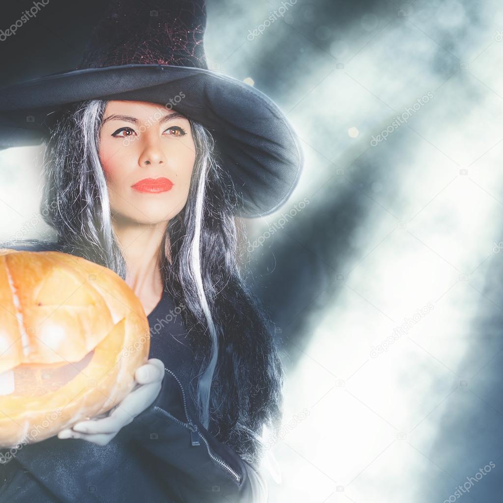 Halloween party 2016! Fashion asian woman like witch holding pumpkin