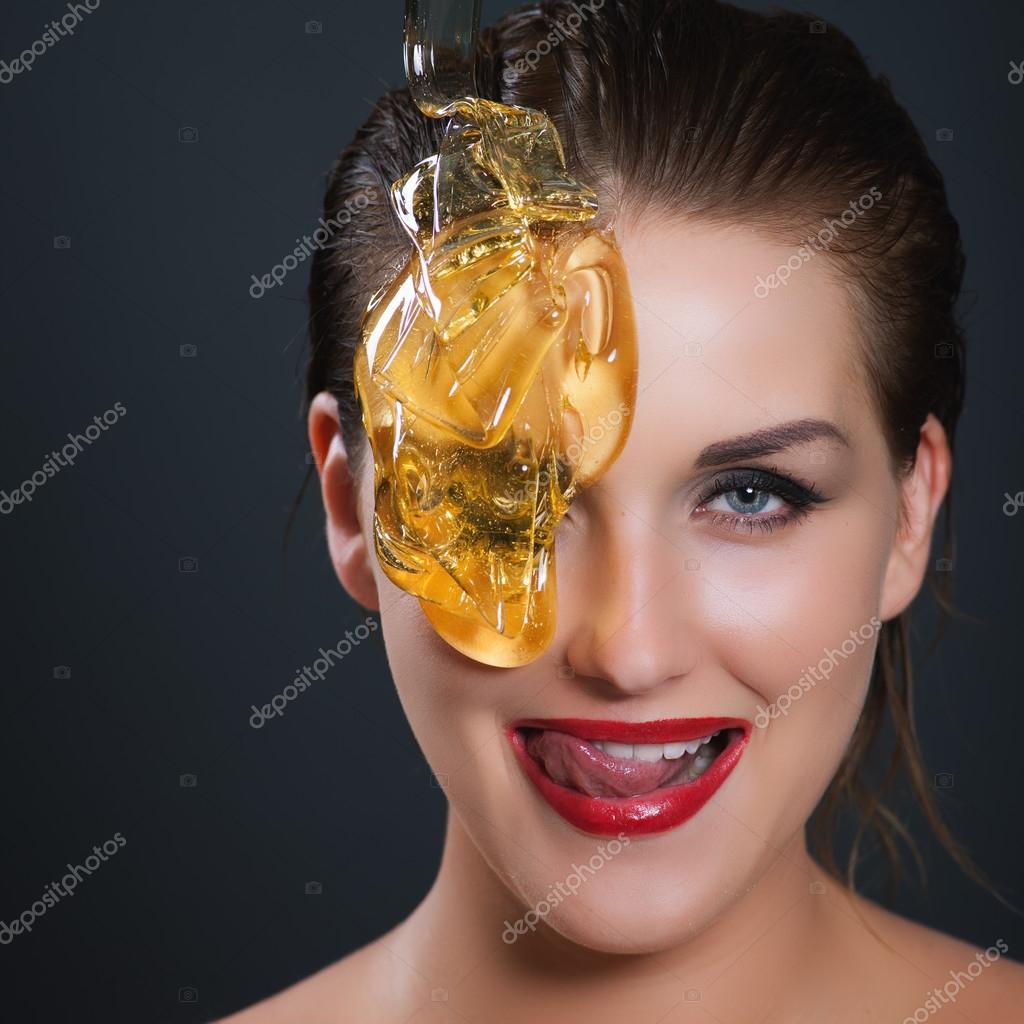 Concept sugaring epilation skin care with liquid sugar near face