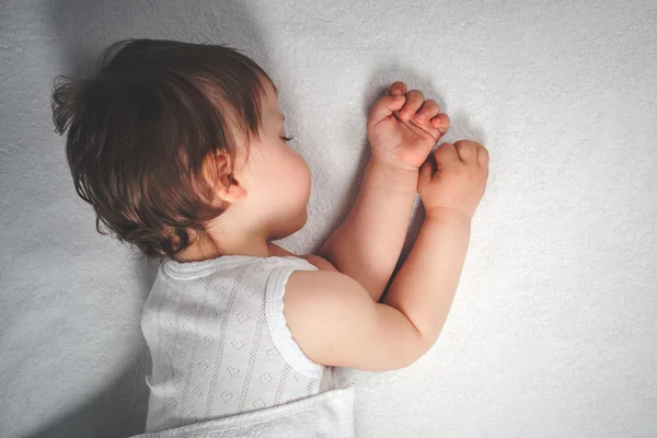 Baby sweet sleeping on a white bed background — Stock Photo, Image