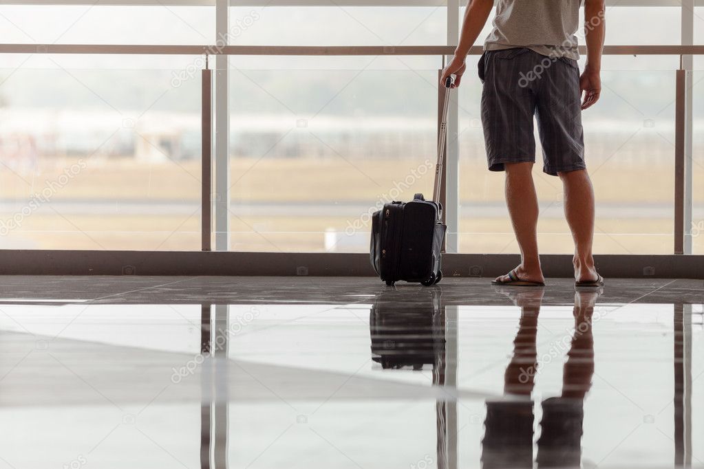 Man carries your luggage at the airport terminal
