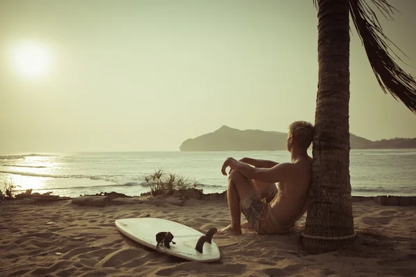 Old photo of surfer near the palm — Stock Photo, Image