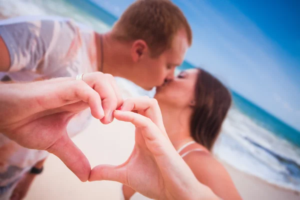 Young couple with love sign — Stock Photo, Image