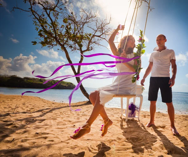 Bride ride on a swing — Stock Photo, Image