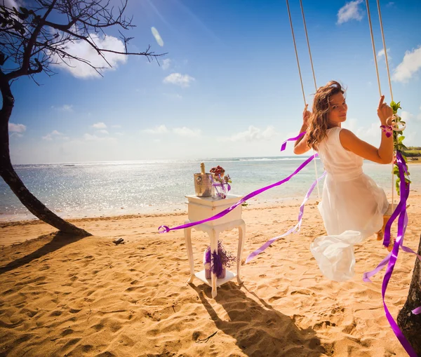 Background of bride ride on a swing — Stock Photo, Image