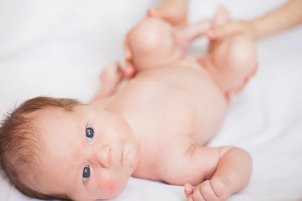 Newborn baby lying on a white background — Stock Photo, Image