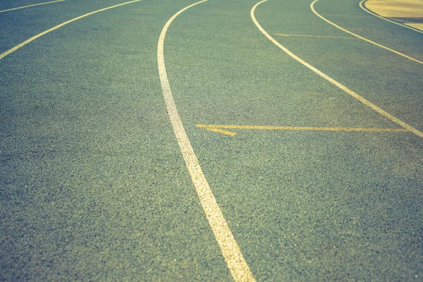 Background of blue track for running at stadium — Stockfoto