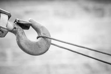 Part of crane on the background of heavy industrial machinery
