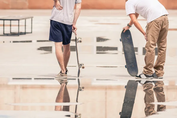 Handsome guys with skateboard at freestyle park outdoors — 스톡 사진