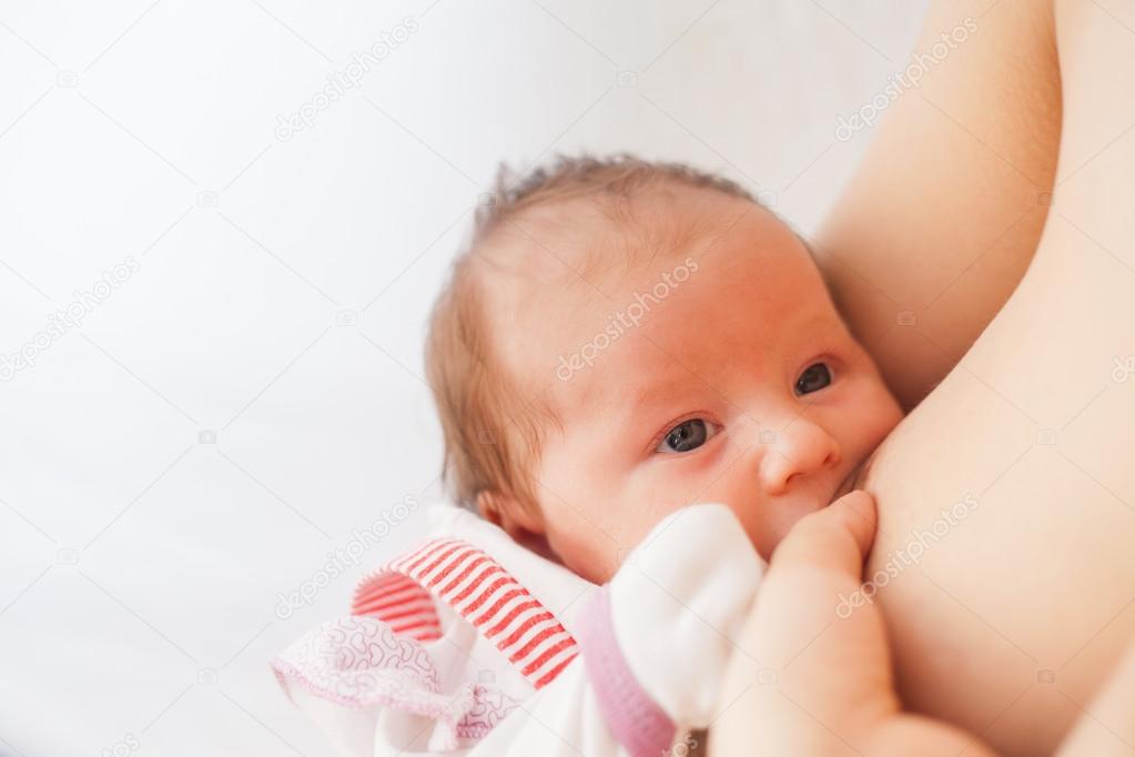 Mother breast feeding a cute baby 