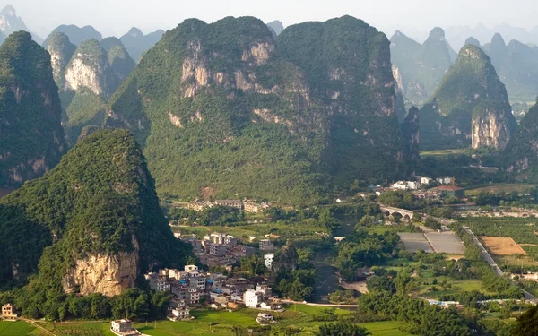 Guilin village at sunset from Moon Hill mountain. Yangshuo, China, Asia — стокове фото