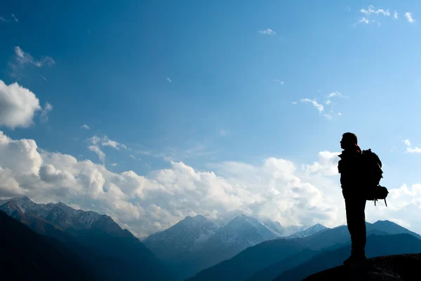 Climbing young adult at the top of summit — Stock Photo, Image