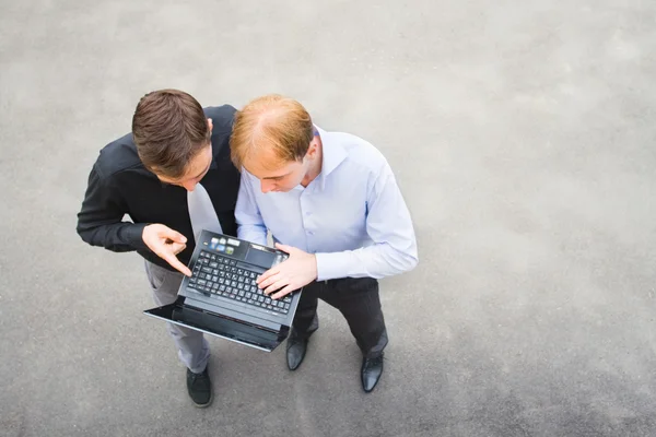 A business partners working on the street — Stock Photo, Image