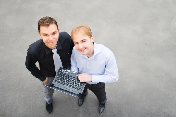 A business partners looking at the camera on the street — Stock Photo, Image