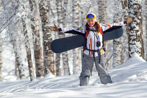 Sport women going for freeride with snowboard — Stock Photo, Image