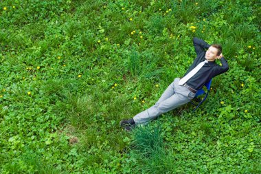 A businessman sitting in the nature