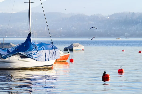 Boats after the winter in the warm February evening — 图库照片