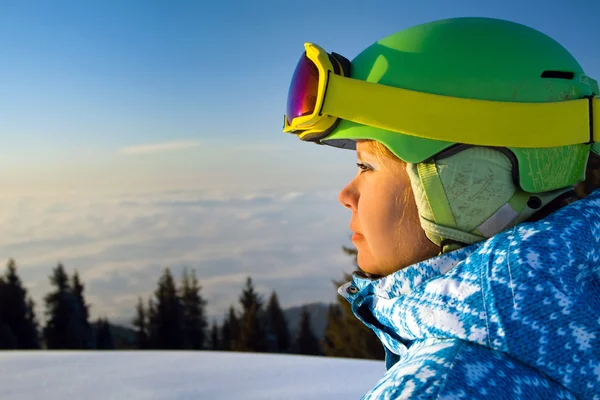 Portrait of a young woman above the clouds at sunset. — Stock Photo, Image