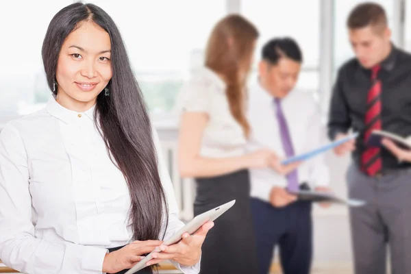 Successful asian business woman holding tablet PC — Stock Photo, Image