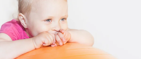 Happy child doing exercises at gymnastic ball — Stock Photo, Image