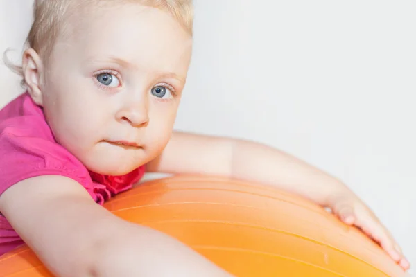 Happy child doing exercises at gymnastic ball — Stock Photo, Image