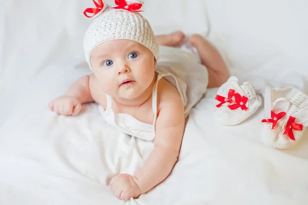 Happy baby girl dressed in knitted bunny costume — Zdjęcie stockowe