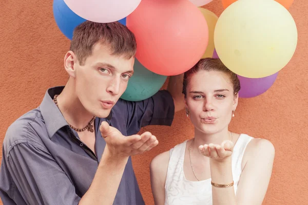 Young people sending a blow kiss to the camera — Stock Photo, Image