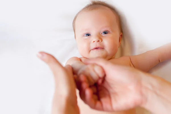 Mother makes massage for happy baby — Stock Photo, Image