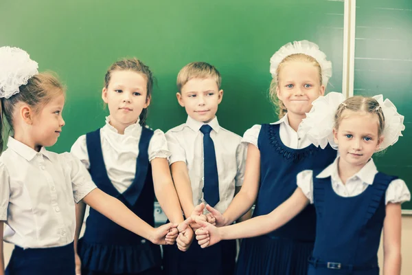 Successful group of children at school with thumb up gesture — Stock fotografie