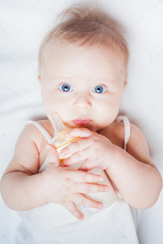 Funny baby holding a bottle with mothers breast milk Stock Photo by ©Petunyia 81475438 Funny baby holding a bottle with mothers breast milk Stock Photo by ©Petunyia 81475438