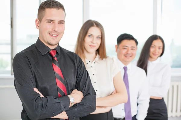 Successful young businessman and his business team — Stock Photo, Image