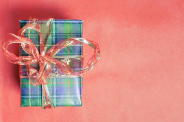 Christmas gift box at red background