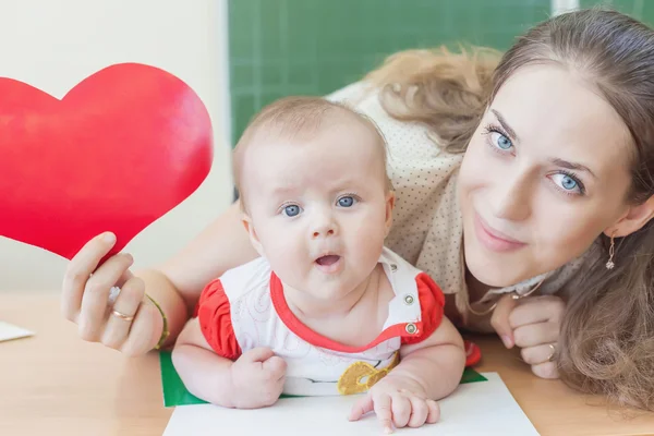 Teacher near blackboard teaching child, baby. Preschool — ストック写真