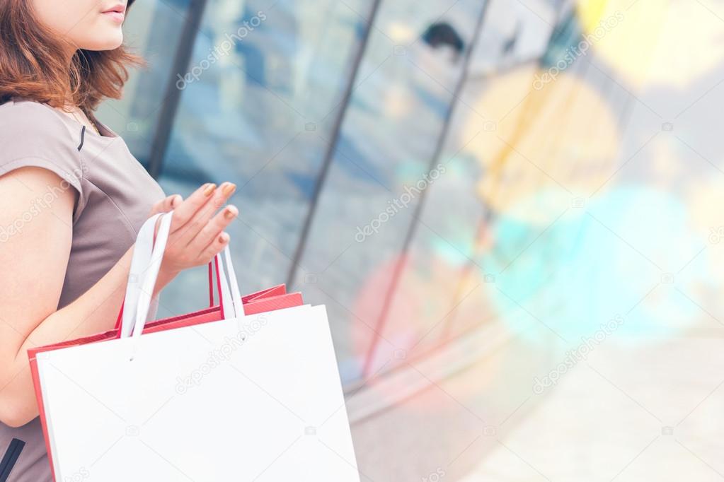 Fashion girl shopping with white bags at Milan, Italy