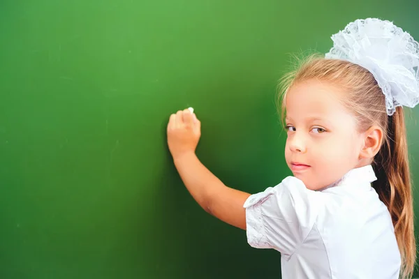 Smart child writing by left hand — Stock Photo, Image