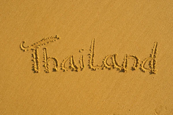 Thailand handgeschreven op zand Rechtenvrije Stockfoto's