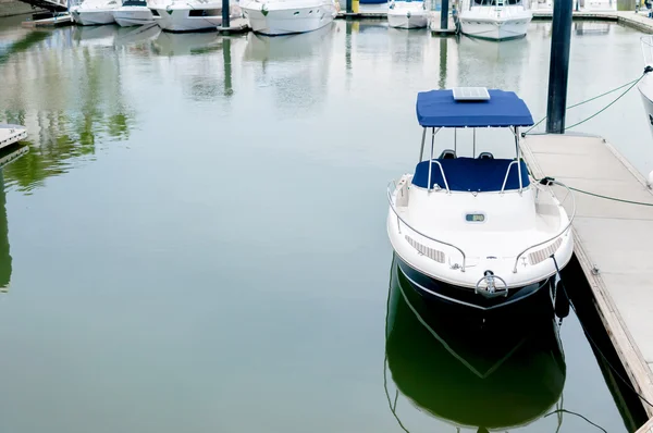 Small motorboat docking at a harbour — Stock Photo, Image