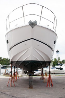 Motorboat from a front view at shipyard clipart