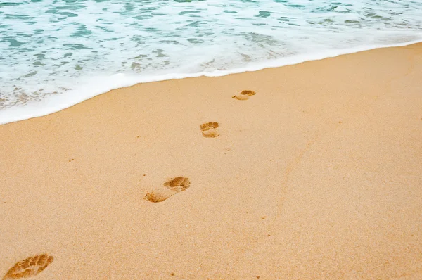 Footprints in the sea sandy beach  on a vacation time in Phuket, — Stock Photo, Image