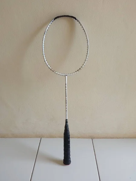 Broken badminton racket without strings